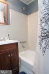 2101-17 Chestnut Street, Unit 323 Philadelphia, PA 19103 - Photo 7 of 7 a bathroom with a sink and a bathtub