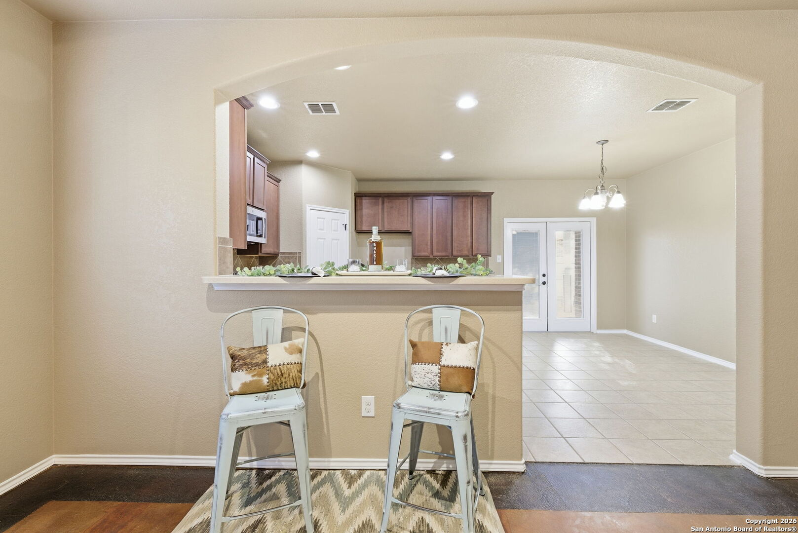 10510 Corvey Lane Helotes, TX 78023 - Photo 16 of 40 a kitchen with stainless steel appliances kitchen island granite countertop a sink and cabinets