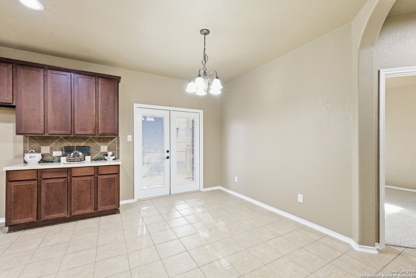 10510 Corvey Lane Helotes, TX 78023 - Photo 18 of 40 a kitchen with granite countertop a stove and a sink