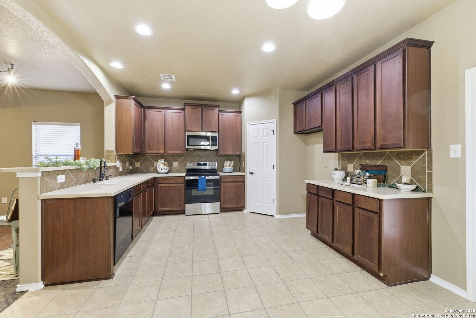 10510 Corvey Lane Helotes, TX 78023 - Photo 19 of 40 a large kitchen with stainless steel appliances lots of counter top space