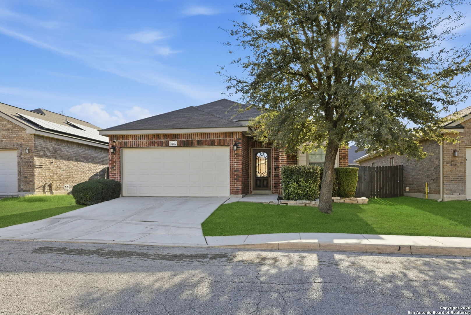 10510 Corvey Lane Helotes, TX 78023 - Photo 2 of 40 a view of a house with a yard and large tree