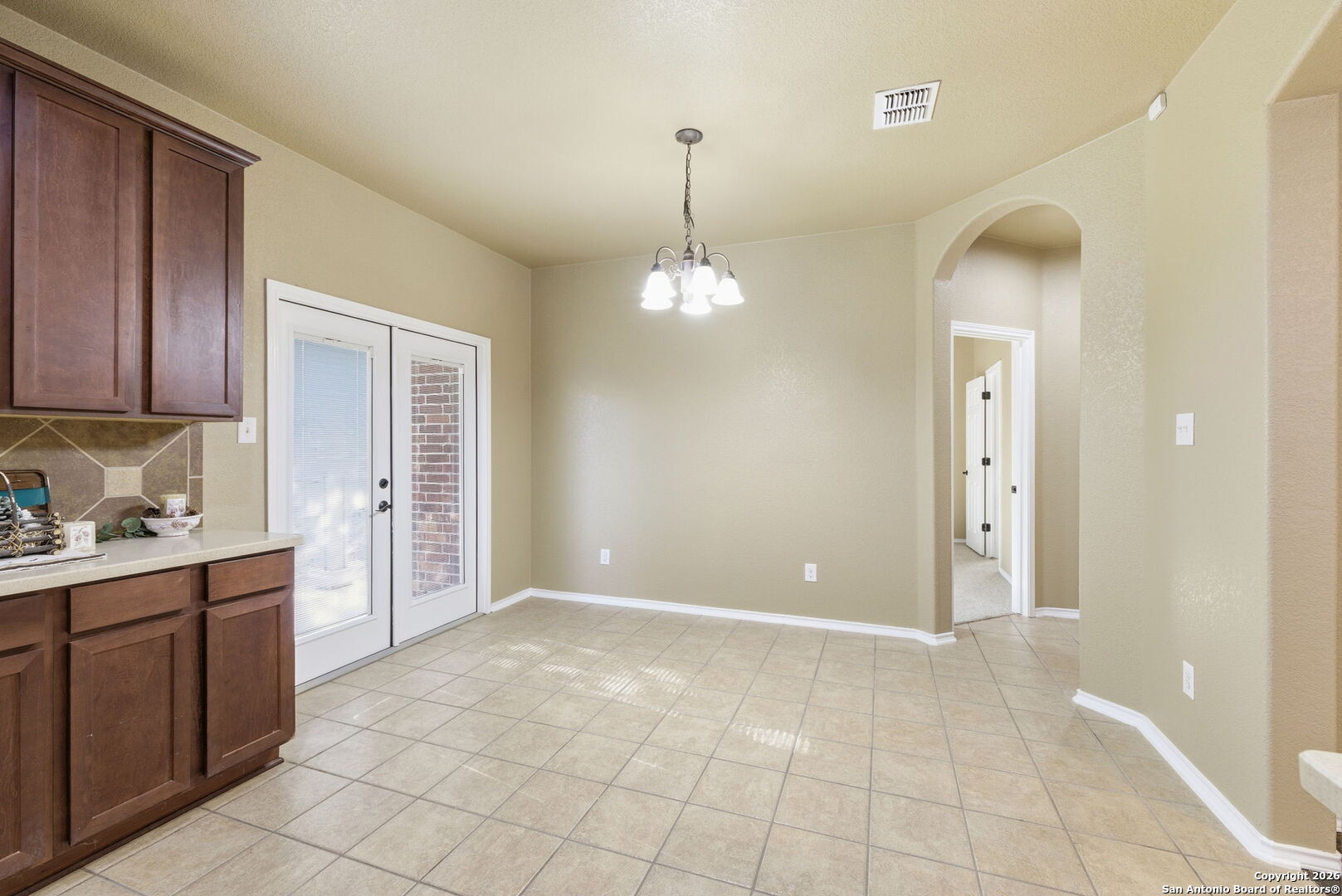 10510 Corvey Lane Helotes, TX 78023 - Photo 22 of 40 a view of a kitchen with a sink cabinets and window