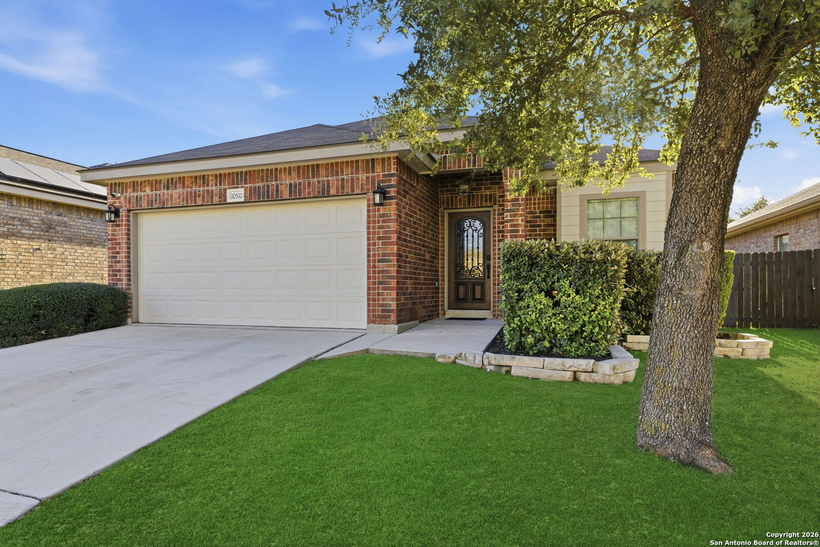 10510 Corvey Lane Helotes, TX 78023 - Photo 3 of 40 a front view of a house with a yard and garage