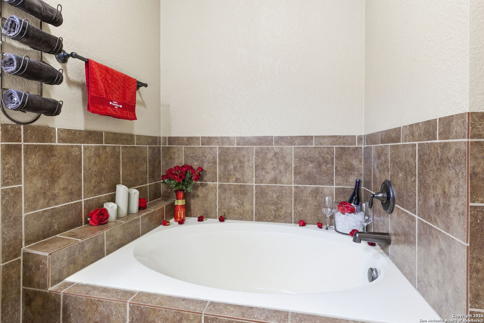 10510 Corvey Lane Helotes, TX 78023 - Photo 32 of 40 a bathroom with a bathtub and a shower
