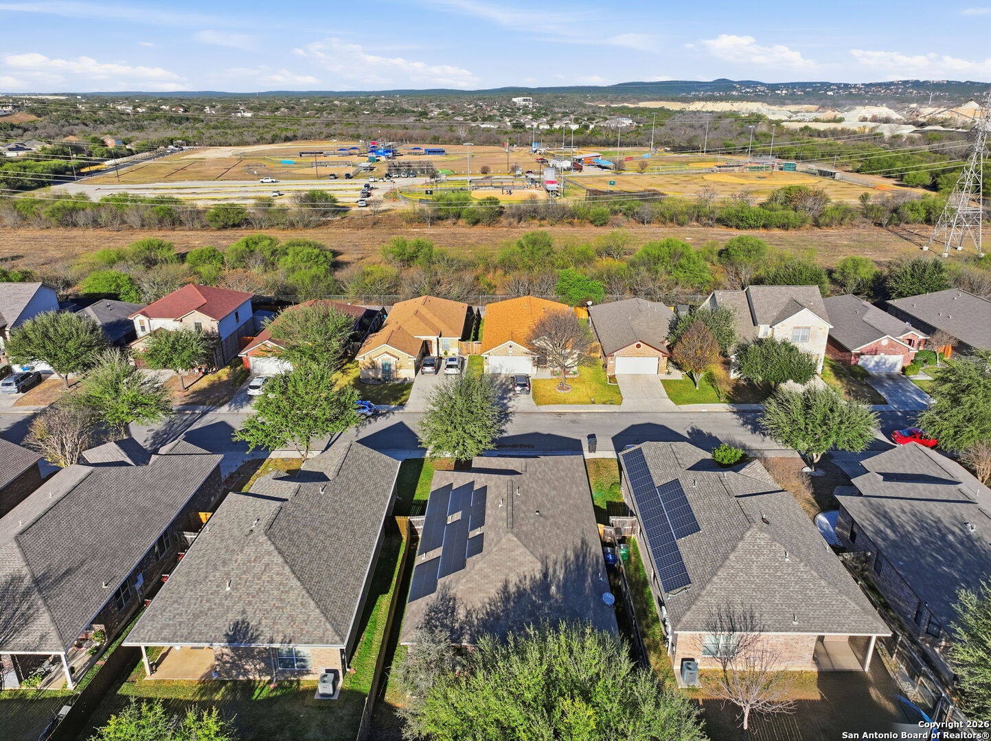 10510 Corvey Lane Helotes, TX 78023 - Photo 37 of 40 an aerial view of residential houses with outdoor space and ocean view
