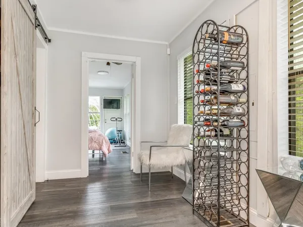 a view of an entryway with wooden floor