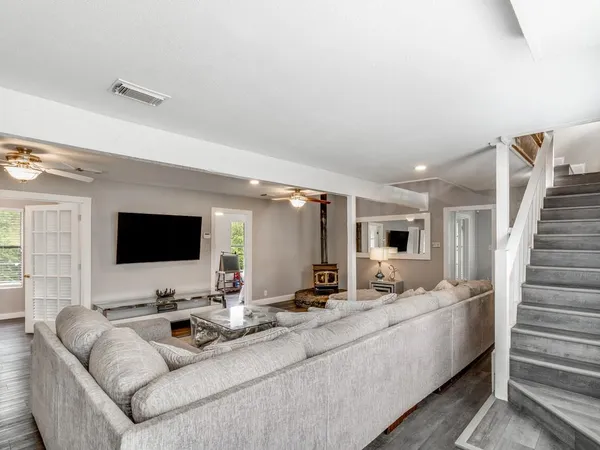 a living room with furniture and a flat screen tv