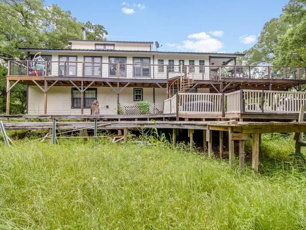 a aerial view of a house with swimming pool and sitting area