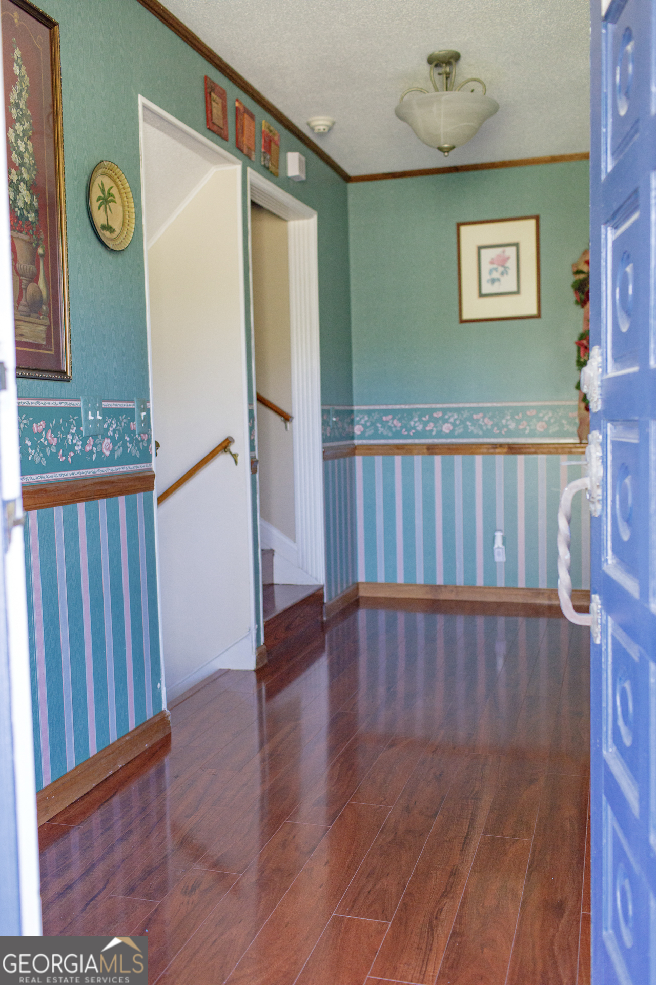 2110 Ware Street Blackshear, GA 31516 - Photo 24 of 57 a view of a hallway with wooden floor and entryway