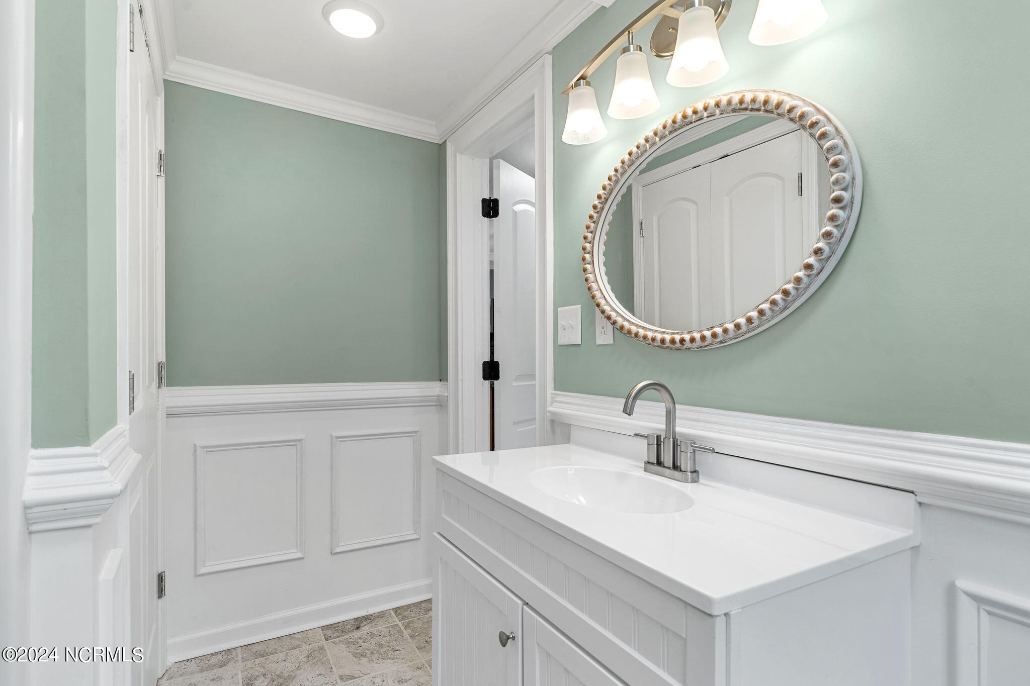 287 Murphys Store Road Rose Hill, NC 28458 - Photo 13 of 27 Bathroom One is very nicely upgraded with wainscoting and a full Linen Closet with a double door entry