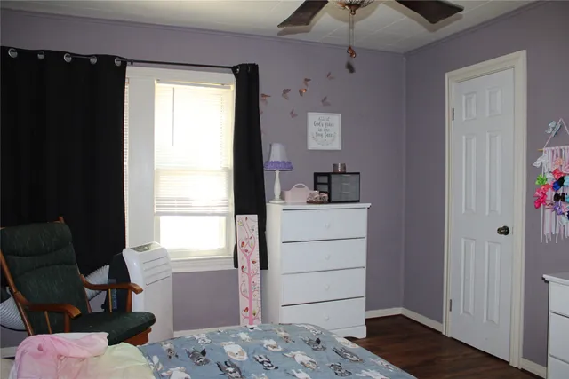 a room with a window and flowerpot