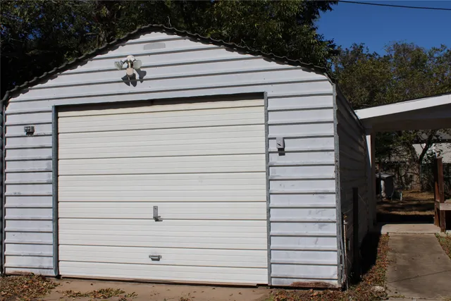 a side view of a house with a yard