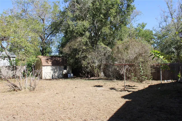 a view of a yard covered in snow