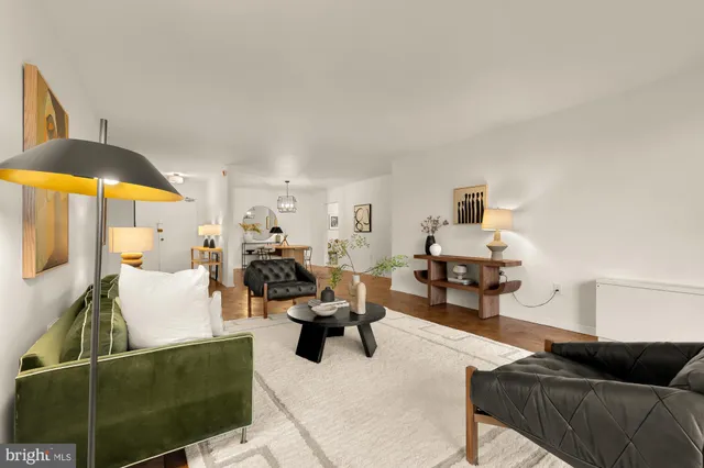 a living room with furniture and a lamp