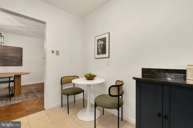 a view of a workspace room with furniture