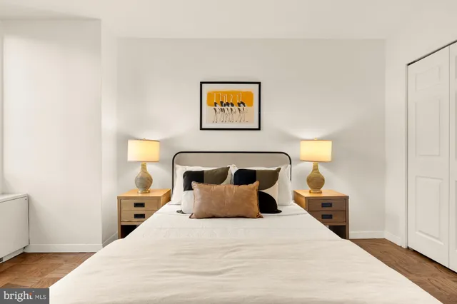 a bed room with a bed and a night stand