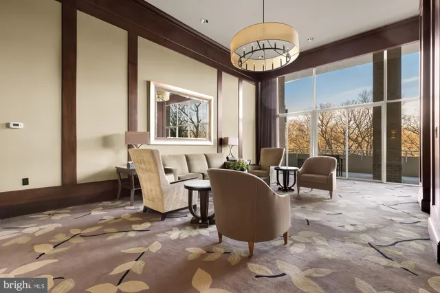 a living room with furniture a window and kitchen view