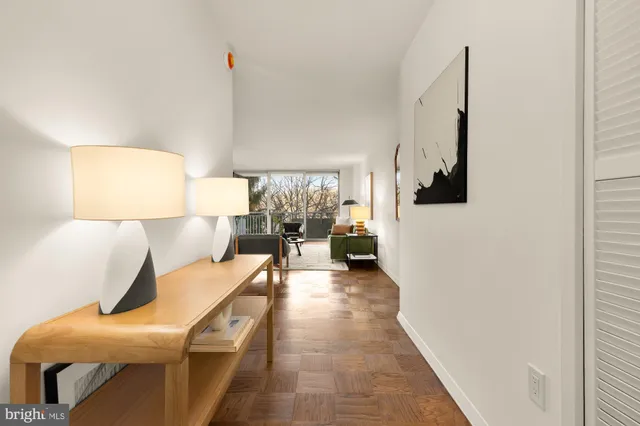 a living room with furniture and a lamp