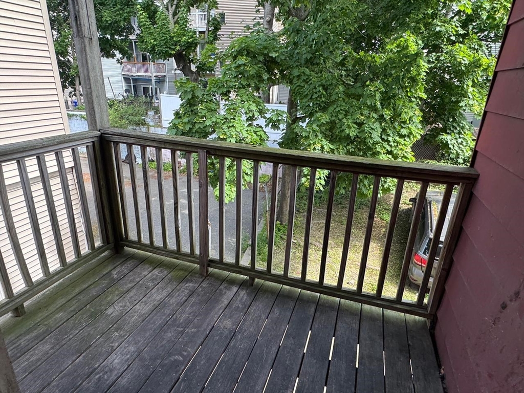 68 Maverick Street Chelsea, MA 02150 - Photo 14 of 16 a view of a balcony with wooden floor