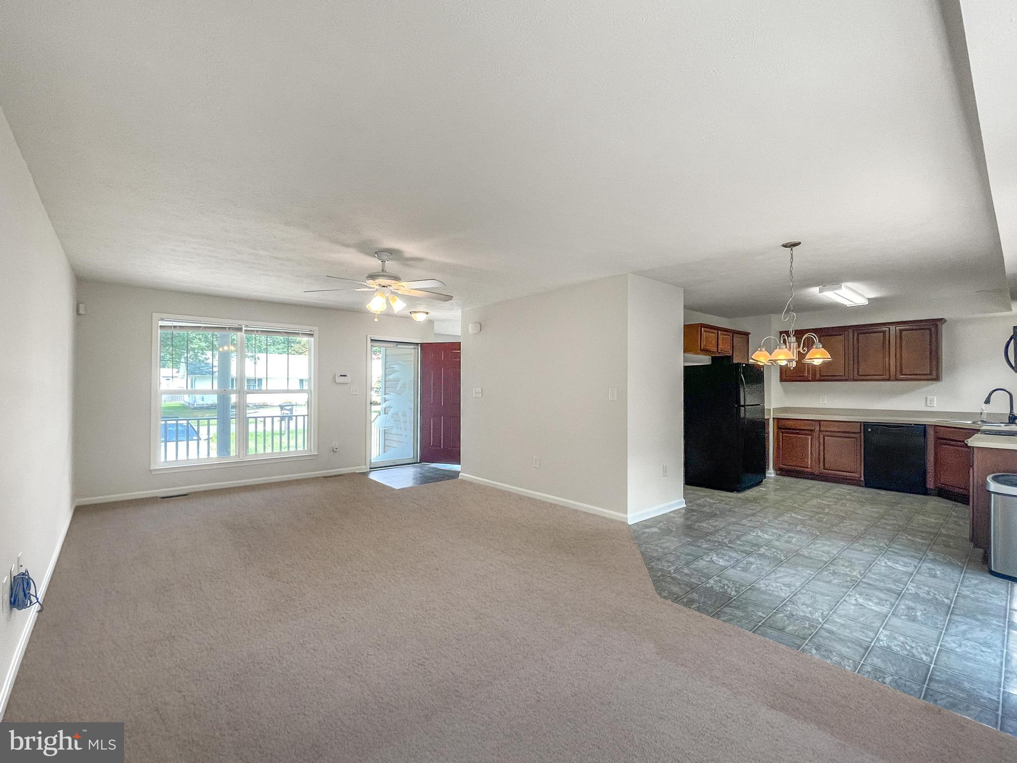 220 5th Street Colonial Beach, VA 22443 - Photo 15 of 25 a view of an empty room with a kitchen