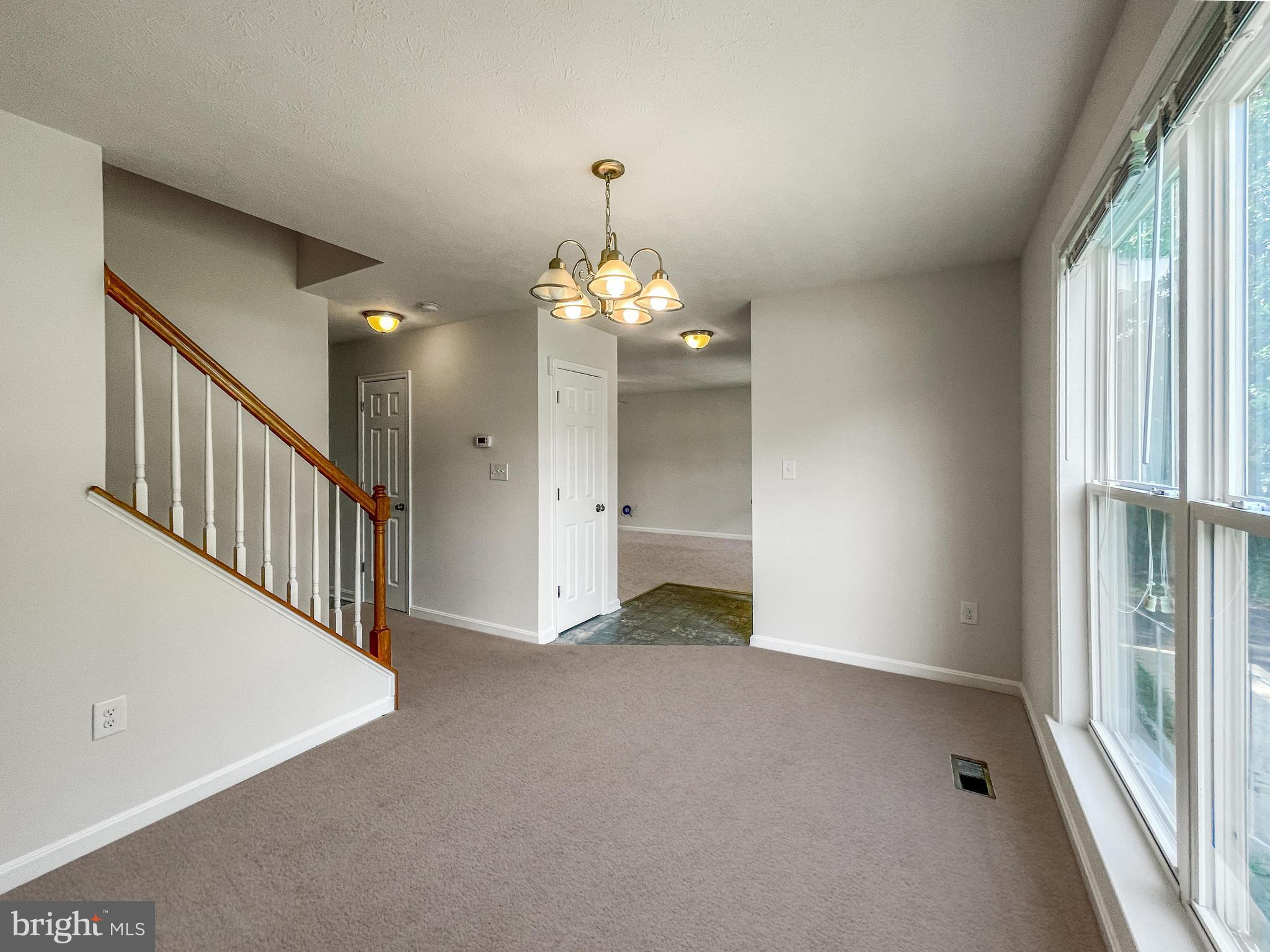220 5th Street Colonial Beach, VA 22443 - Photo 16 of 25 a view of a hallway with entryway and chandelier