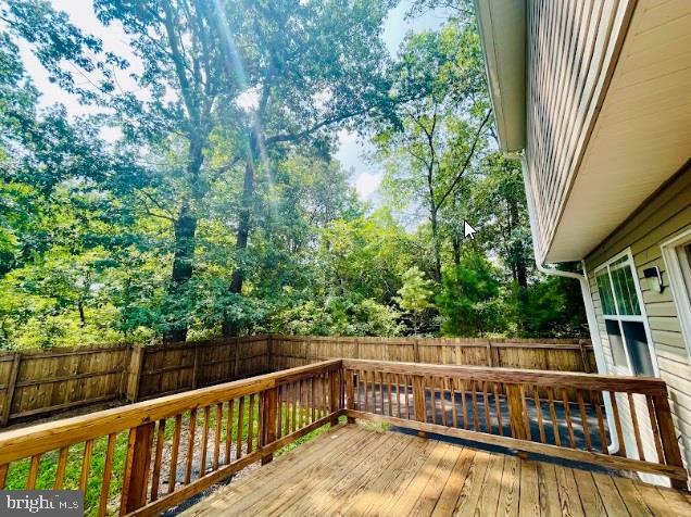 220 5th Street Colonial Beach, VA 22443 - Photo 23 of 25 a view of balcony with deck and trees