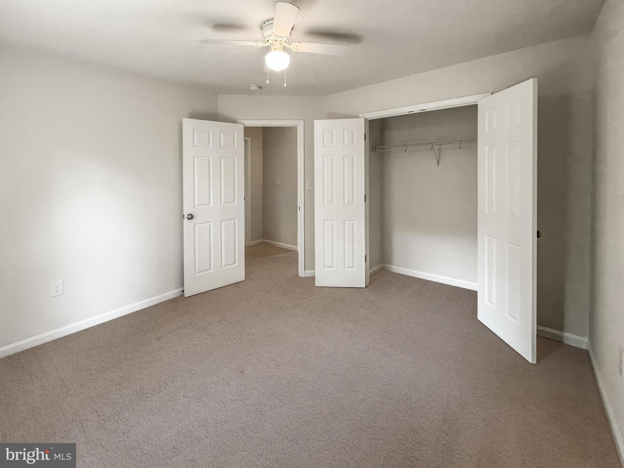 220 5th Street Colonial Beach, VA 22443 - Photo 8 of 25 a view of an empty room and a ceiling fan