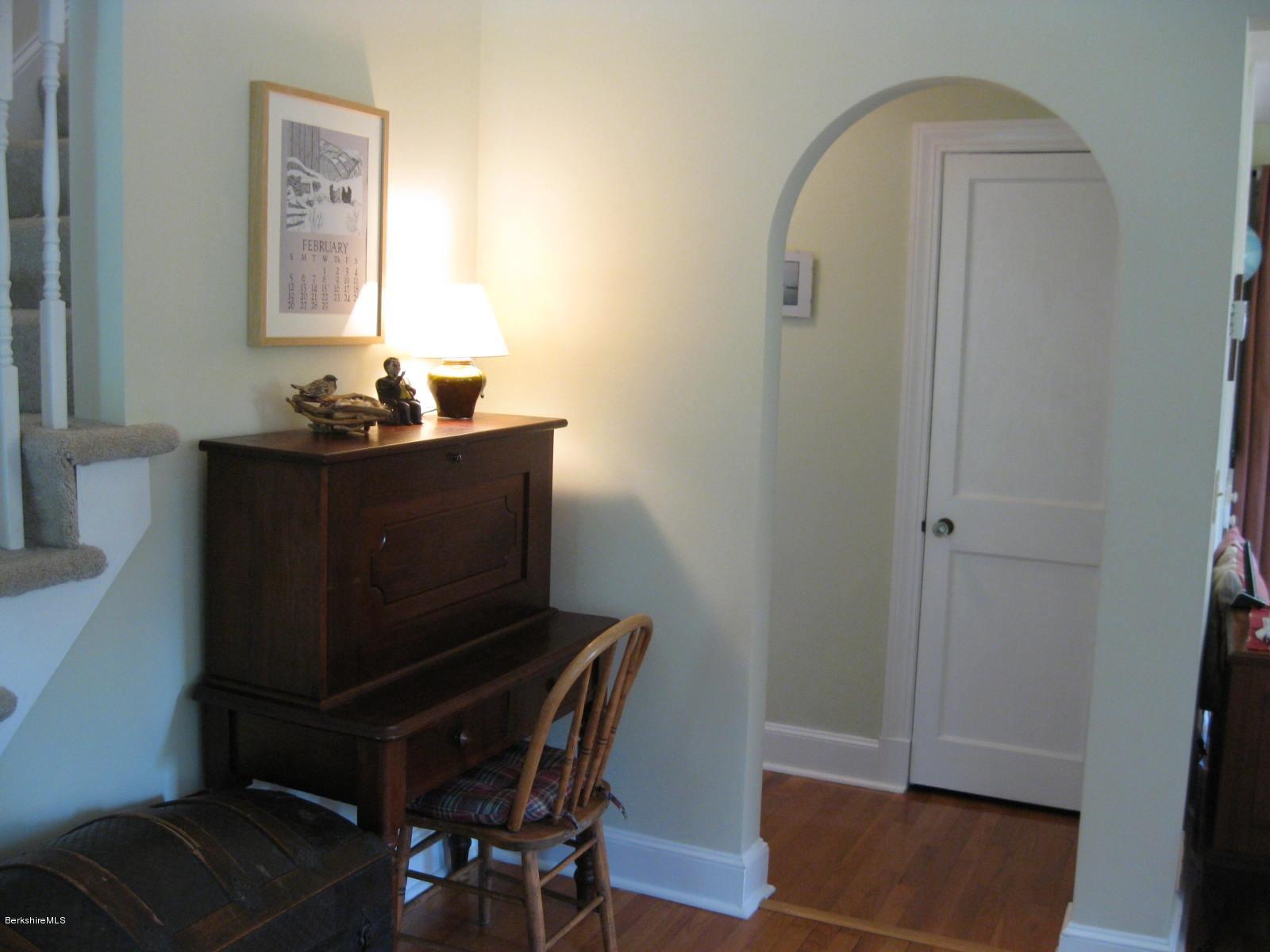 337 Holmes Road Pittsfield, MA 01201 - Photo 14 of 25 Living Room with arch wayt to hall