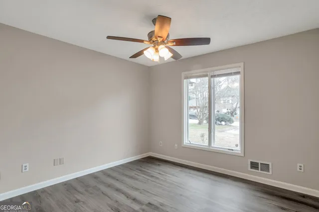 a backyard of a house with lots of green space