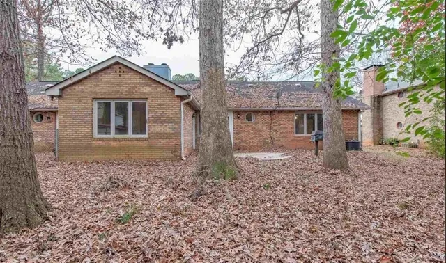 a view of a yard with plants and a trees
