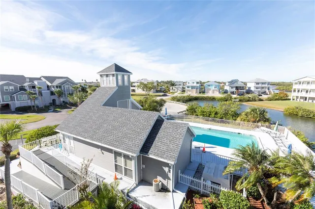 a living room with furniture a window and a chandelier