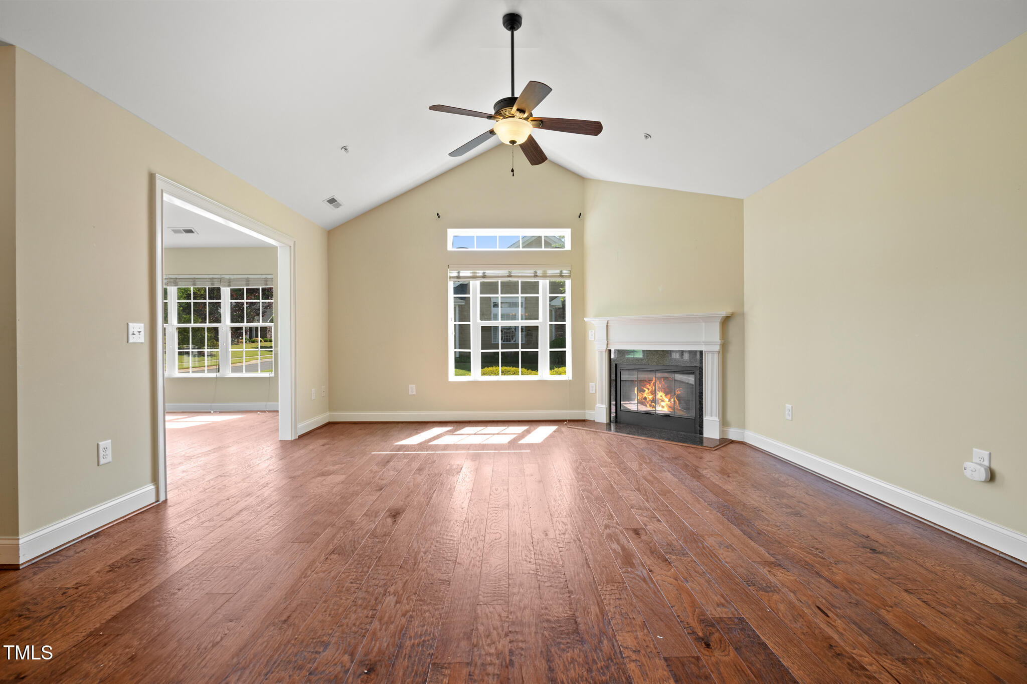 924 Carolina Bell Road Apex, NC 27502 - Photo 6 of 35 Spacious and vaulted great room with gas fireplace, sunroom to the left