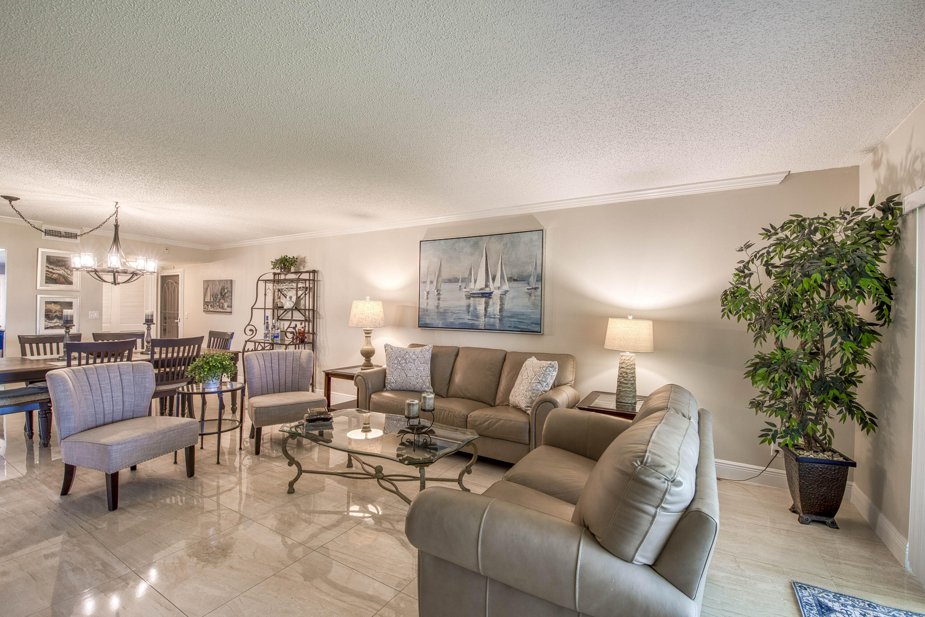 1205 Sandy Lane, Unit 149 Singer Island, FL 33404 - Photo 11 of 28 a living room with furniture and a potted plant