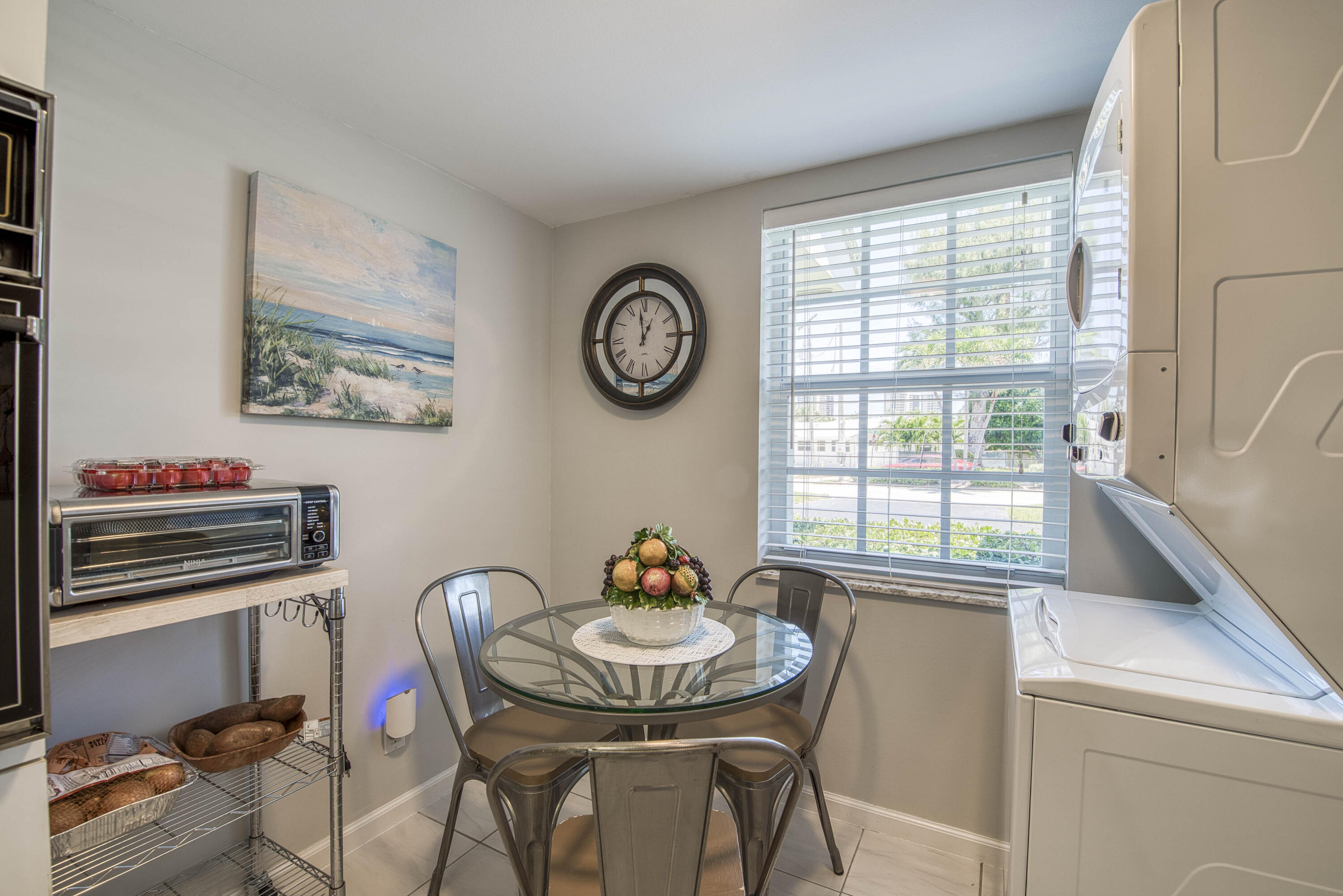 1205 Sandy Lane, Unit 149 Singer Island, FL 33404 - Photo 15 of 28 a view of a dining room with furniture window and outside view