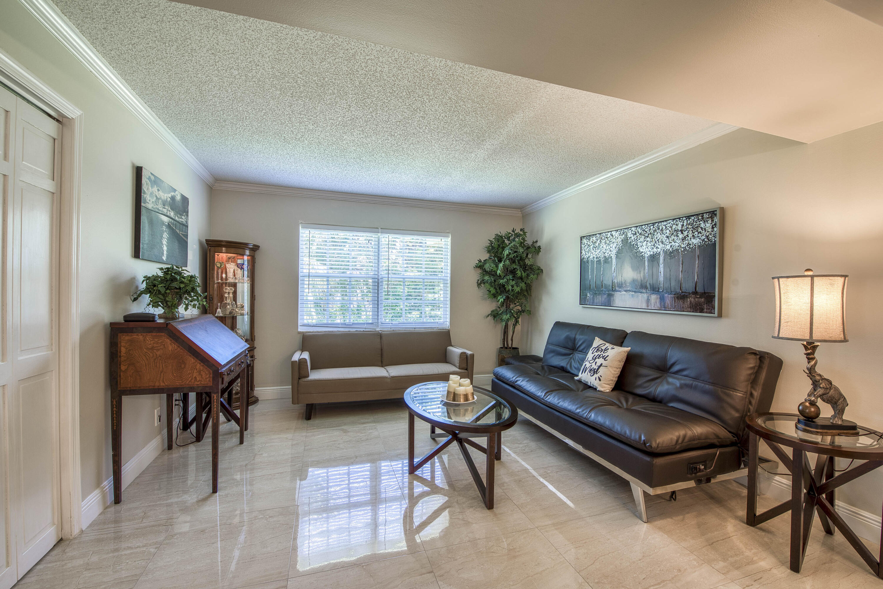 1205 Sandy Lane, Unit 149 Singer Island, FL 33404 - Photo 17 of 28 a living room with furniture and a window