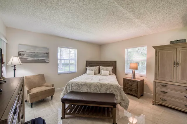 a bathroom with a double vanity sink a mirror and a shower
