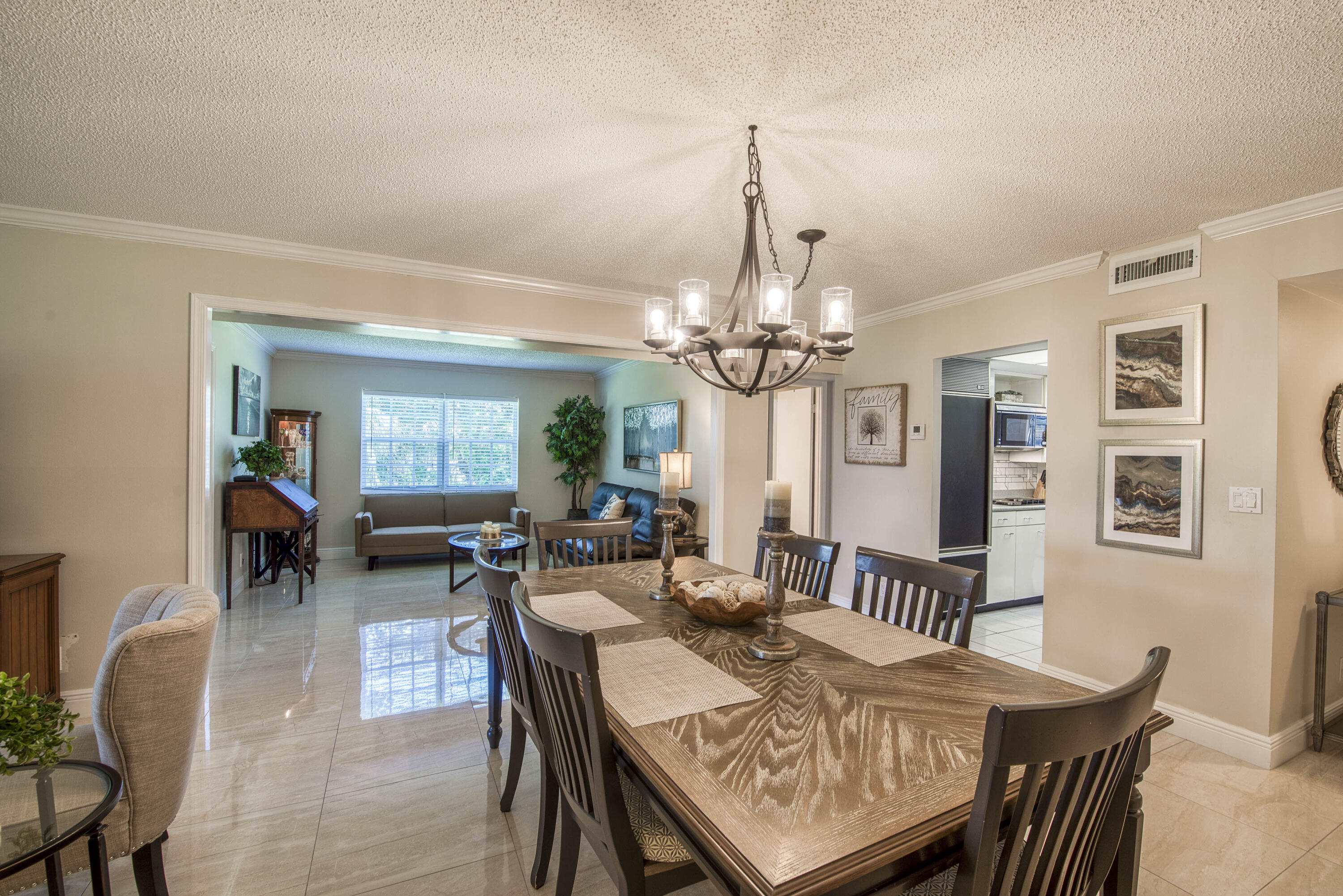 1205 Sandy Lane, Unit 149 Singer Island, FL 33404 - Photo 5 of 28 a view of a dining room with furniture