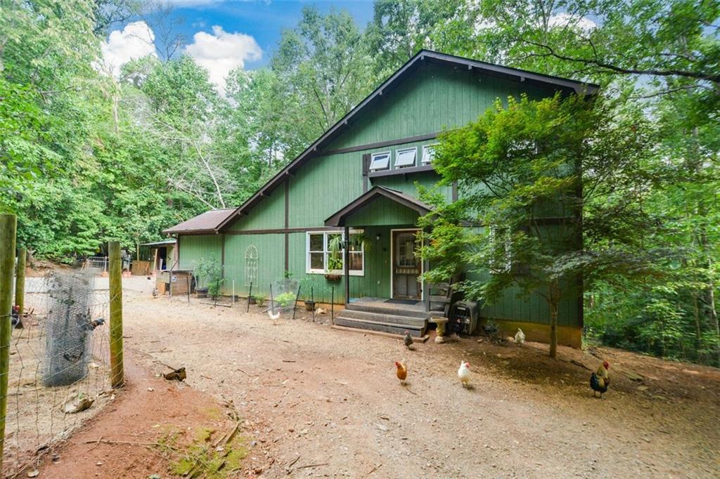 770 Ash Ridge Road Waleska, GA 30183 - Photo 1 of 1 a backyard of a house with lots of green space
