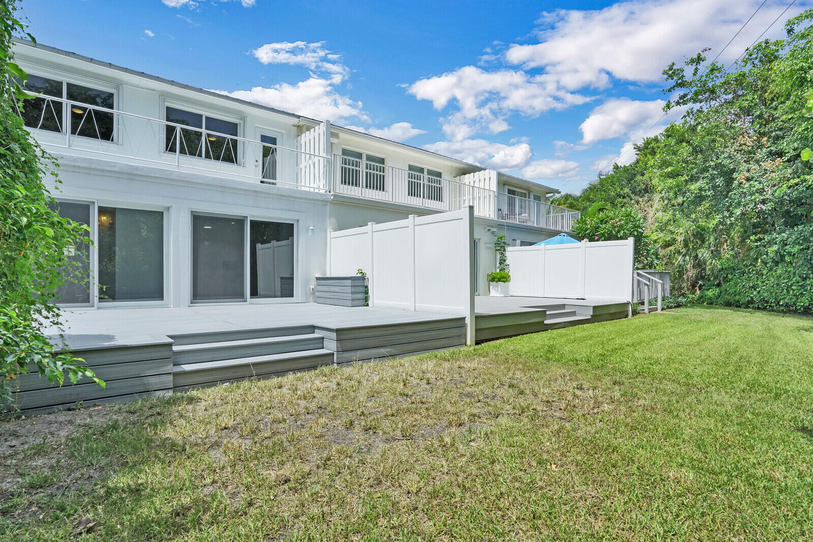 29 E Road Delray Beach, FL 33483 - Photo 29 of 34 a view of an house with backyard and a tree