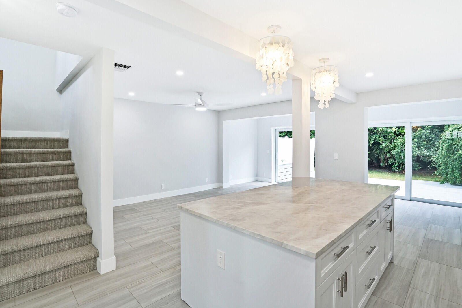 29 E Road Delray Beach, FL 33483 - Photo 7 of 34 an empty room with wooden floor and windows