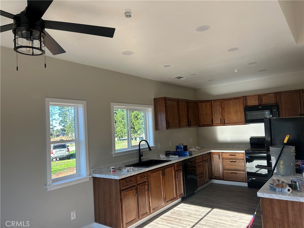 14014 Creston Road Magalia, CA 95954 - Photo 12 of 30 a kitchen with a sink window and cabinets