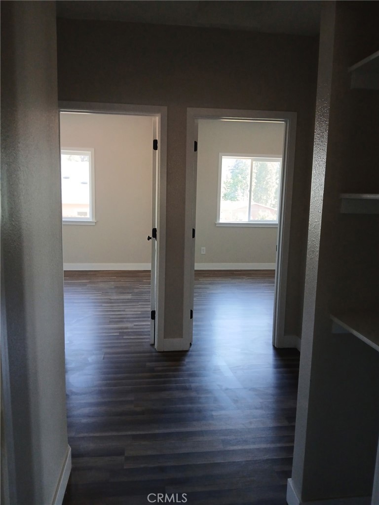 14014 Creston Road Magalia, CA 95954 - Photo 17 of 30 a view of a hallway with wooden floor and a window