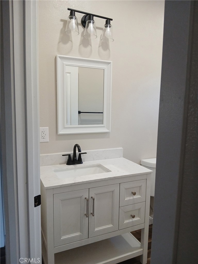 14014 Creston Road Magalia, CA 95954 - Photo 21 of 30 a bathroom with a sink a vanity and a mirror