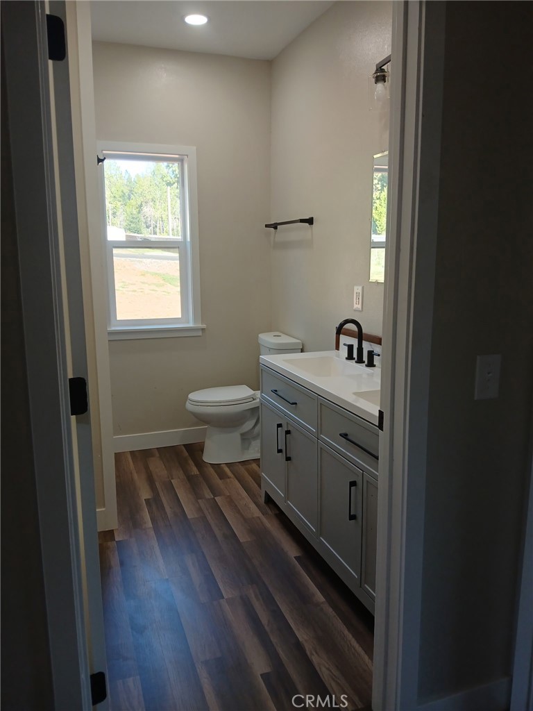14014 Creston Road Magalia, CA 95954 - Photo 25 of 30 a bathroom with a sink a toilet and a window