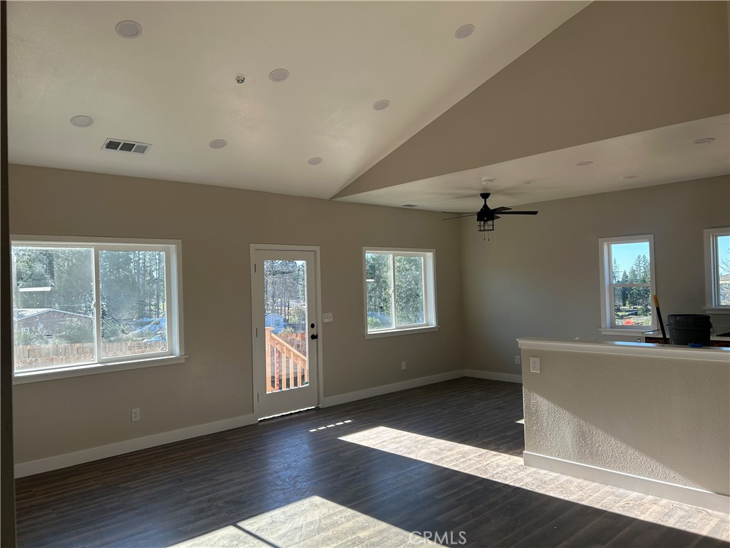 14014 Creston Road Magalia, CA 95954 - Photo 5 of 30 a view of an empty room with wooden floor and a window