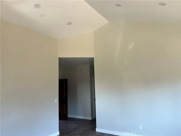 a view of hallway with wooden floor
