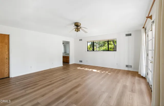 a view of an empty room with a window