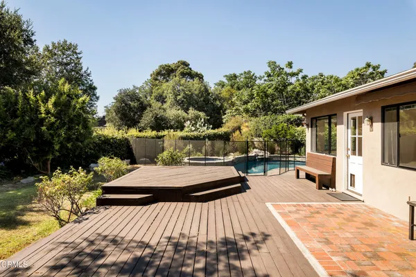 a view of a backyard with sitting area