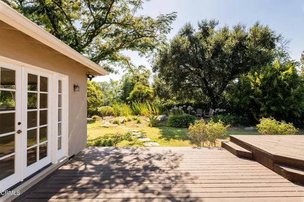 a view of a backyard of the house