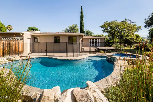a view of a swimming pool with a patio